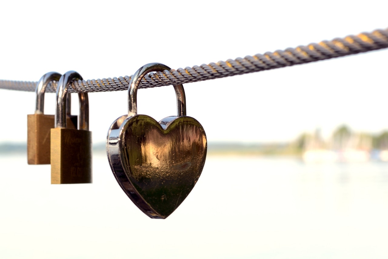 a heart-shaped padlock and two regular padlocks